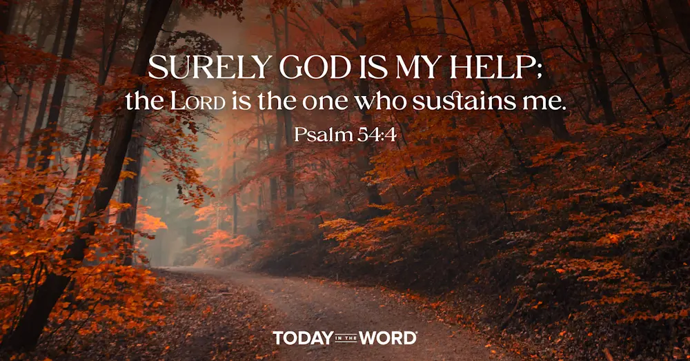 Daily devotional Bible verse Psalm 54:4 Surely God is my help; the LORD is the one who sustains me. | A road through an autumn woods.